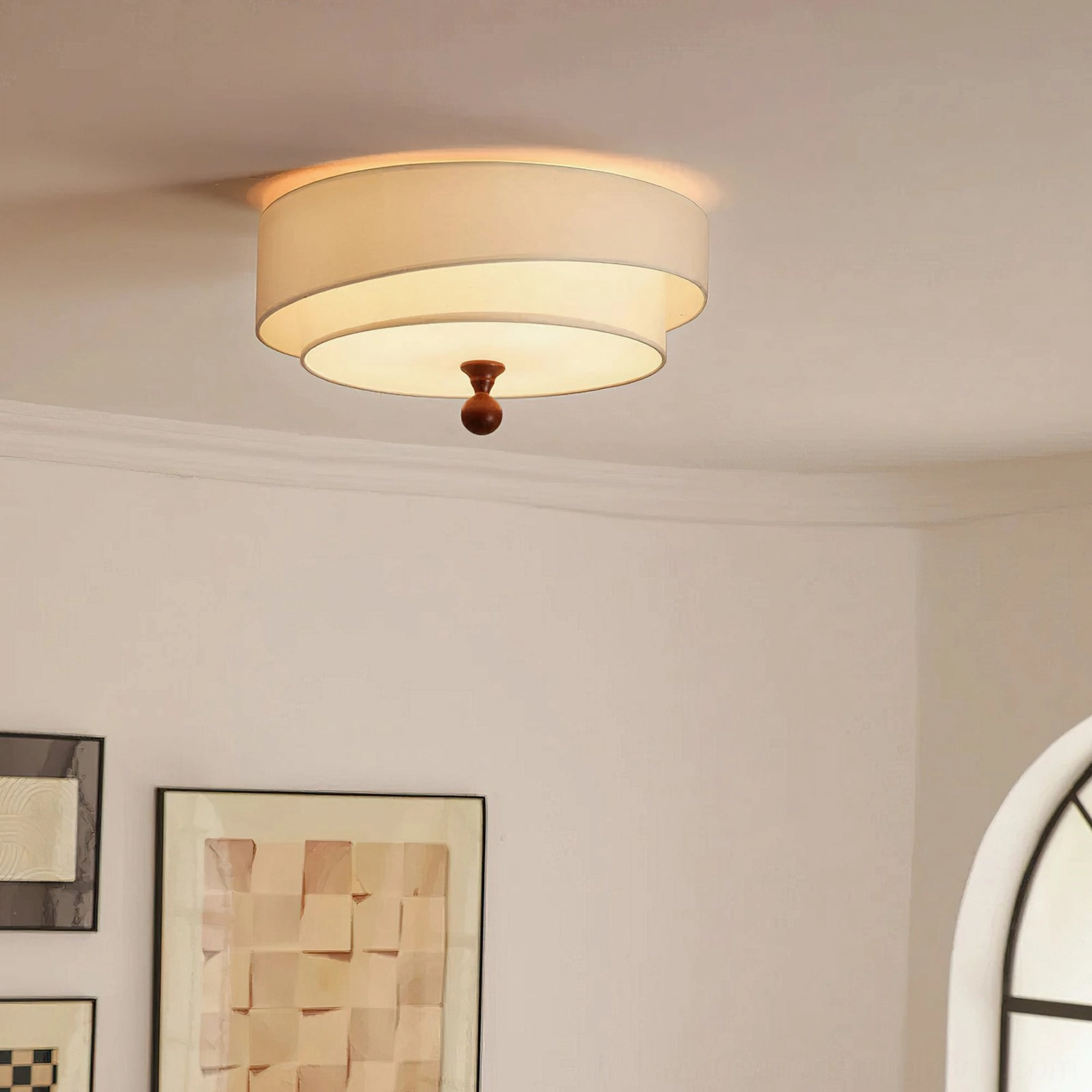 Vanelia mid-century flush mount lamp with white cream shade in minimalist residential room, side angle view showing clean retro design and wooden finial detail