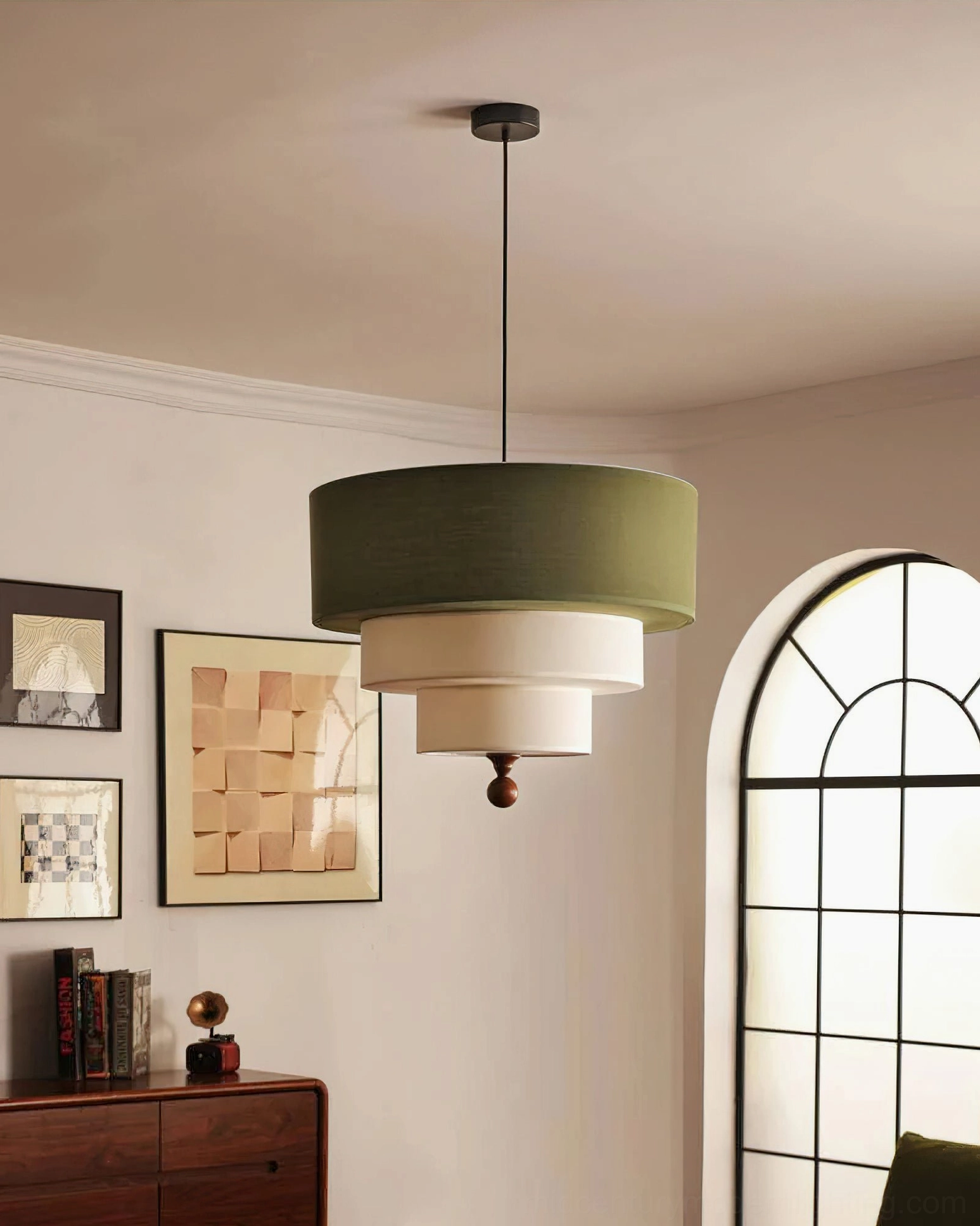 Vanelia pendant lamp with olive green top tier and off-white lower layers suspended in vintage living room with arched architectural window feature