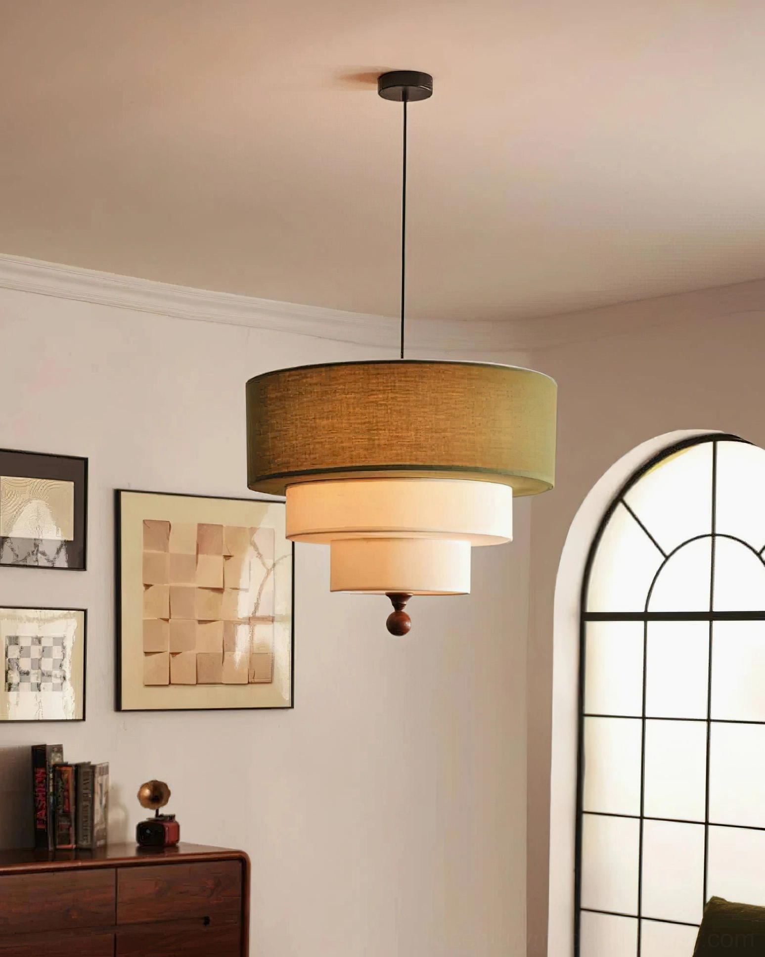 Vanelia green and white tri-tier pendant lamp eye-level side view showing fabric shade texture and wooden finial, residential space with wall art decor