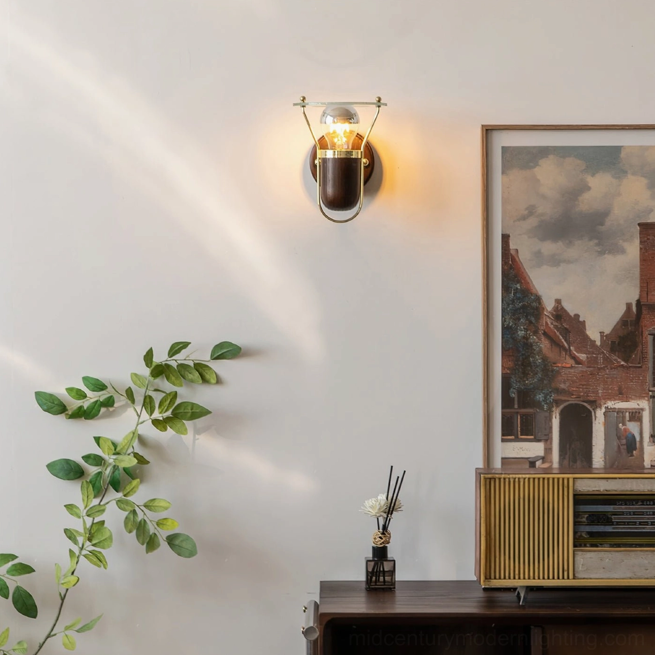 Vaughan mid-century modern wall sconce close-up of clear acrylic diffuser and brass mounting hardware