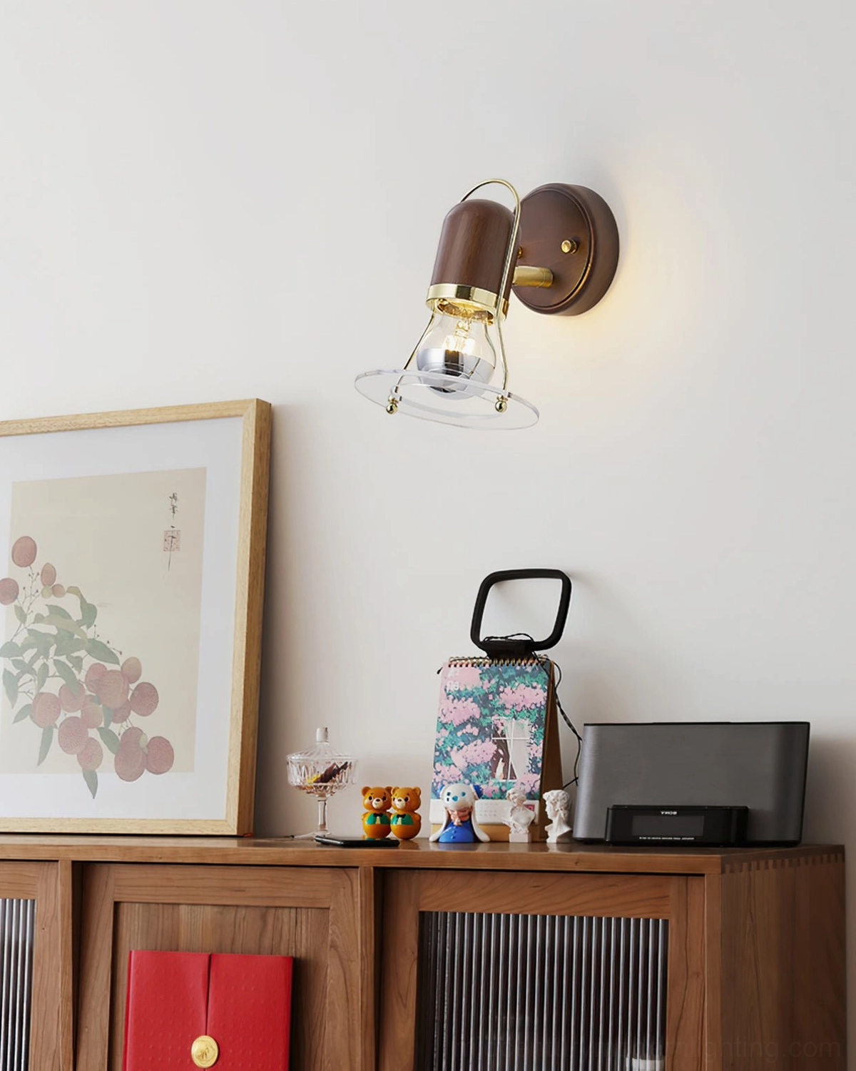 Vaughan wall sconce displayed in home cabinet area with Japanese-style decorative accessories