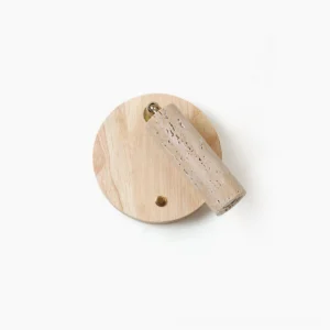 Veda travertine wall sconce overhead view with natural wood backplate and porous beige stone cylinder on white background