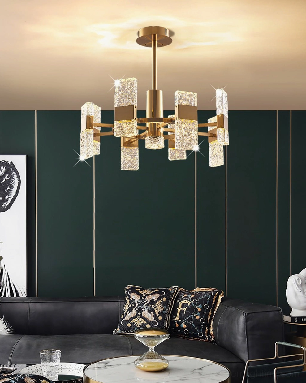 Modern Vega brass glass chandelier in living room with dark green accent wall