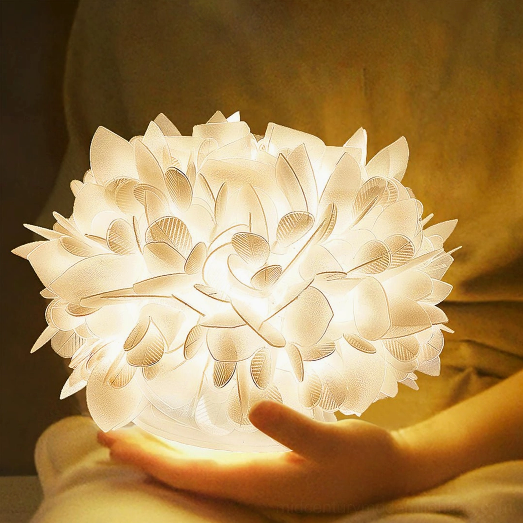 Veli Foliage table lamp held in hand showing scale and soft warm glow indoors