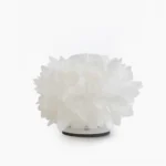 Veli Foliage petal table lamp with white shade and black base on minimalist white background