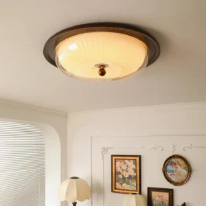 Veneta warm dimmable ceiling light illuminated in vintage French living room with arched windows