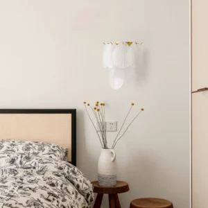 Verbier wall lamp installed in modern farmhouse bedroom above nightstand with warm ambient lighting