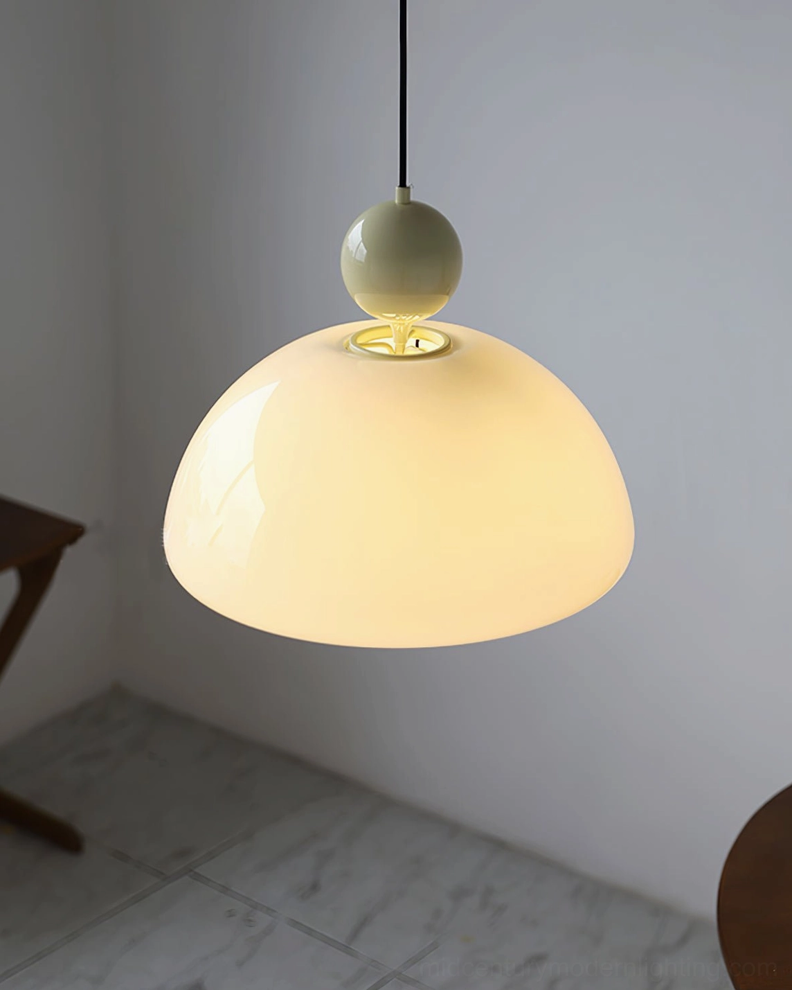Verona hand-blown glass pendant with decorative orb accents and refined metal hardware assembly