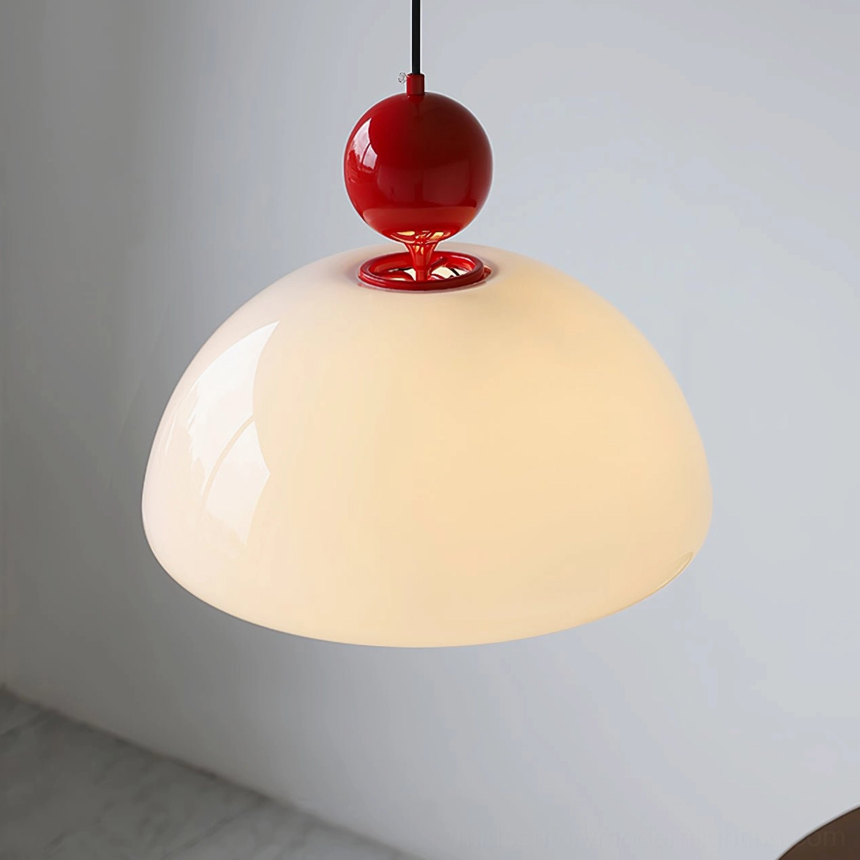 Verona glass pendant with glossy red spherical accents and creamy milk glass dome in home corner
