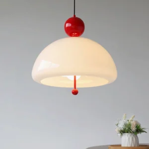 Verona pendant light installed in modern home interior with minimalist side table and floral arrangement