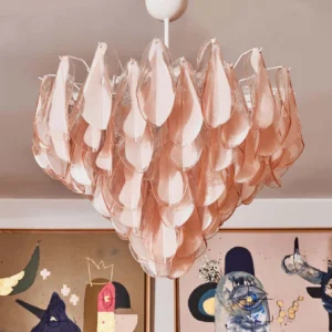Pink Murano glass chandelier installed on white ceiling, soft blush petal layering and warm glow in residential interior