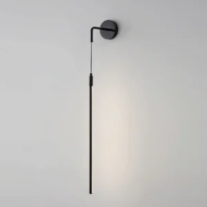 Vesta matte black three-color changing wall lamp side angle against white wall