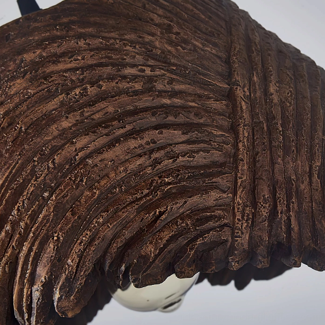 Macro side close-up of Viana shade showing deep layered striated texture and irregular edge detail