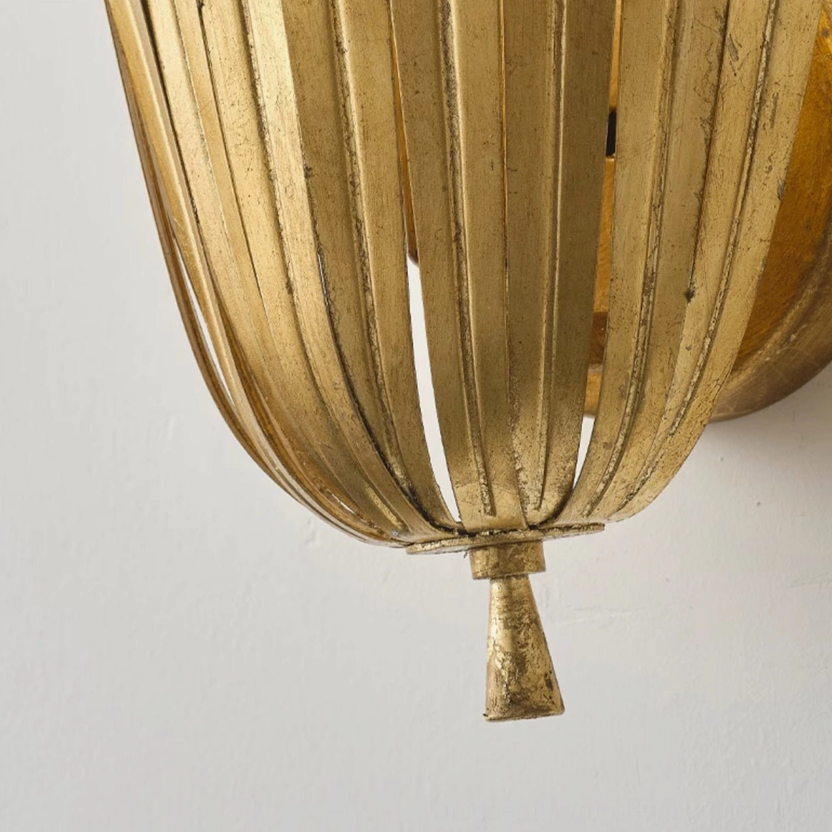 Vicenzio Art Deco wall sconce installation example showing layered leaf structure and shadow play on wall