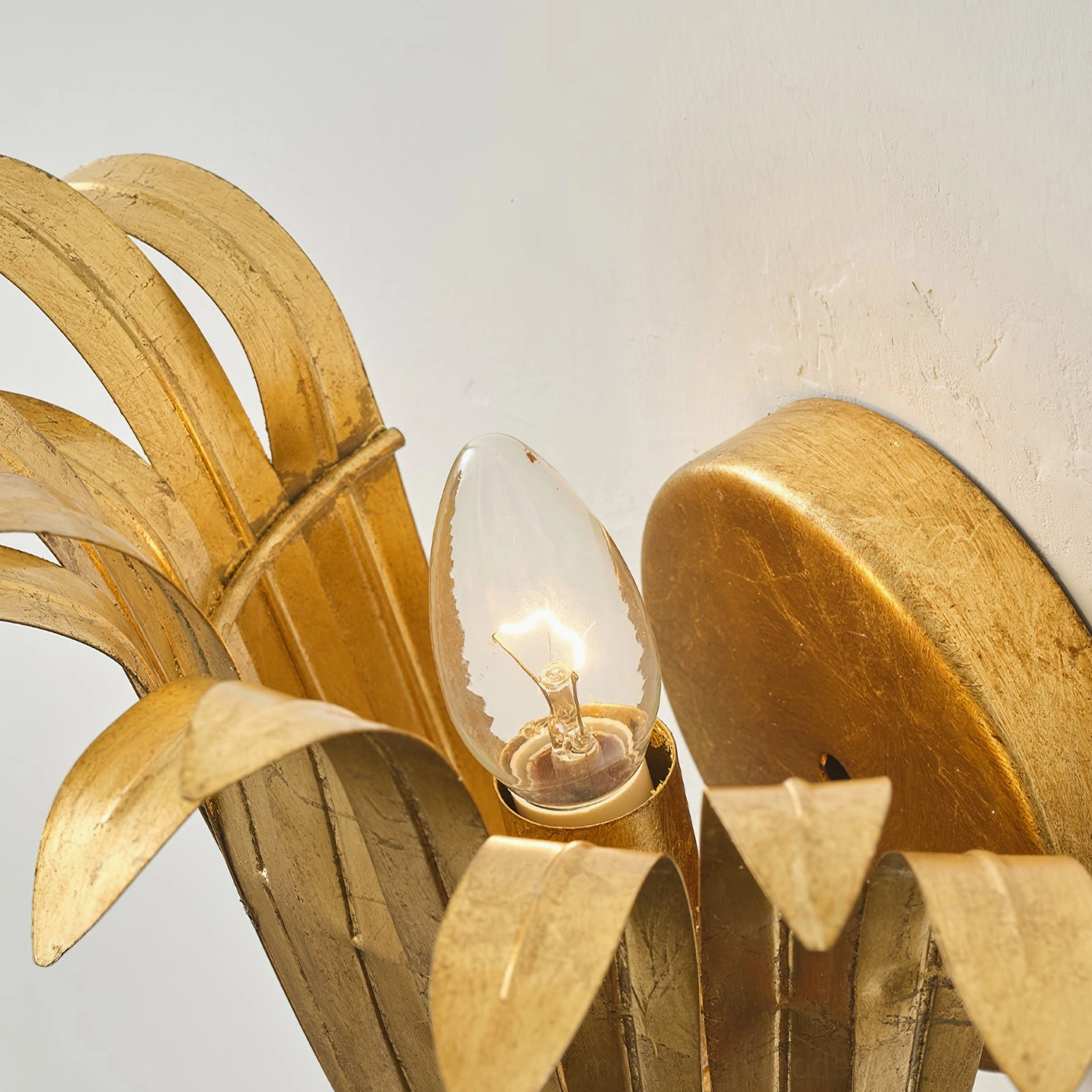 Vicenzio Leaf Wall Sconce ambient lighting effect - warm glow through botanical leaf design in interior space