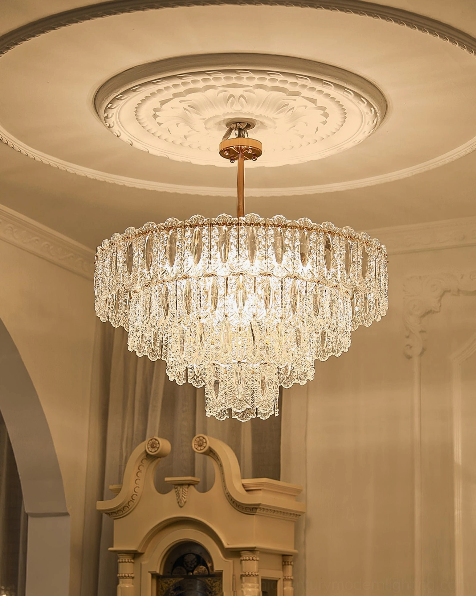 Vienna crystal chandelier in European vintage living room overhead view with ornate ceiling medallion