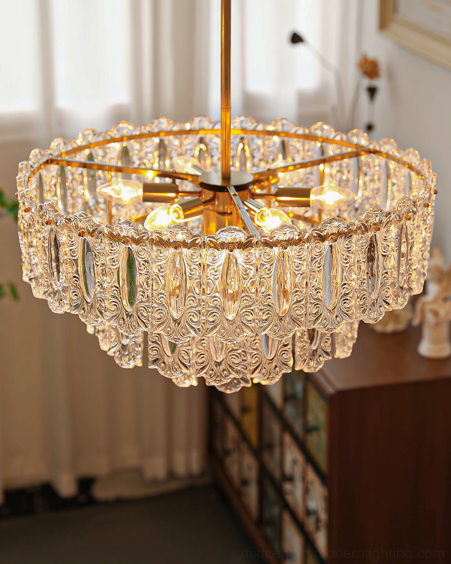Vienna crystal chandelier in American living room corner with carved glass details and exposed lamp sockets