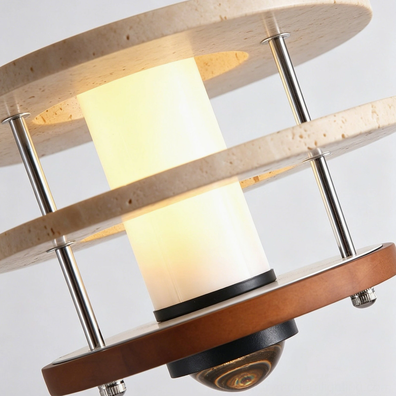 Close-up detail view of Vigo pendant lamp showing travertine stone discs, metal support rods, frosted glass cylinder and natural stone texture