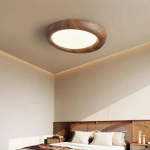 Modern flush mount ceiling light installed in contemporary master bedroom, warm wood tones with integrated LED