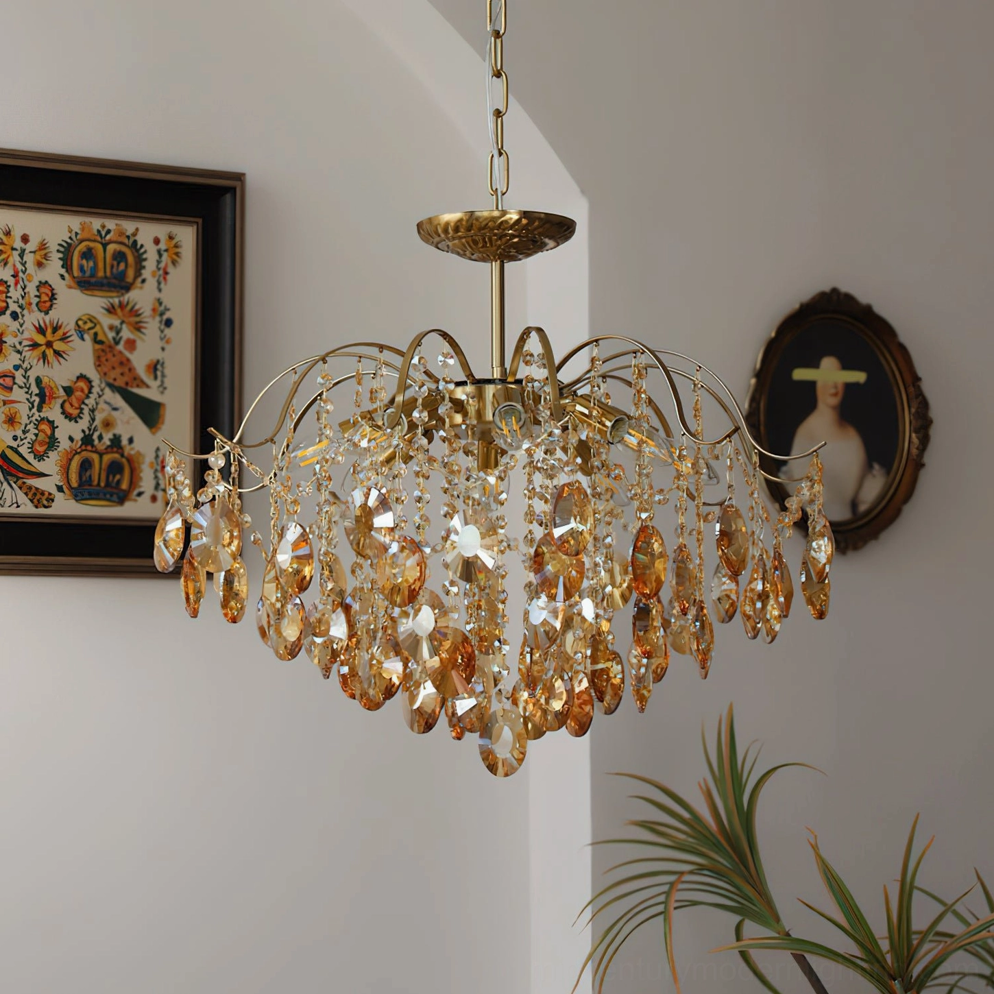 Vintage amber crystal chandelier side three-quarter view with curved brass frame and mixed crystal tones in interior space