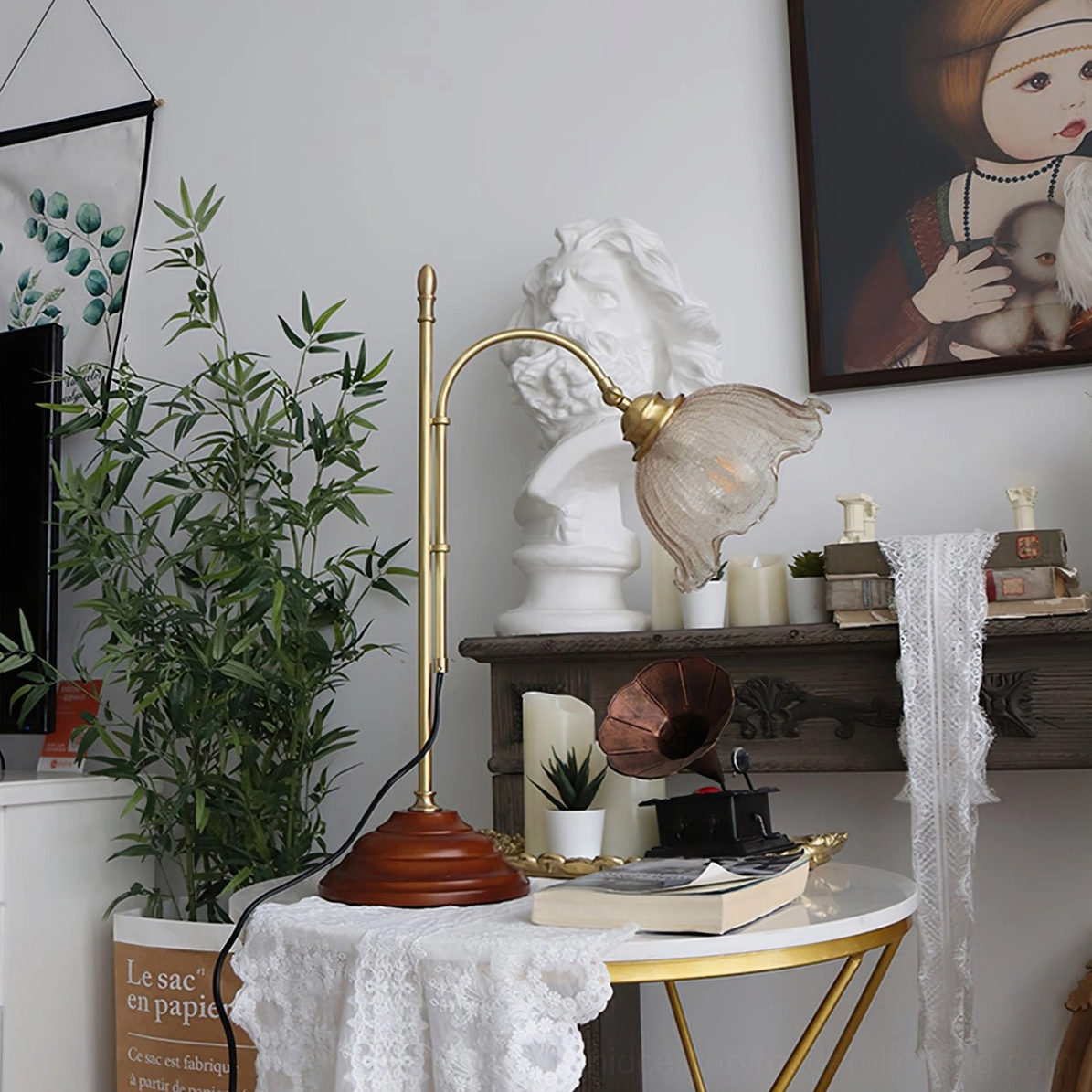 Vintage lamp in home studio environment with plants and artwork, side angle showing sculptural form