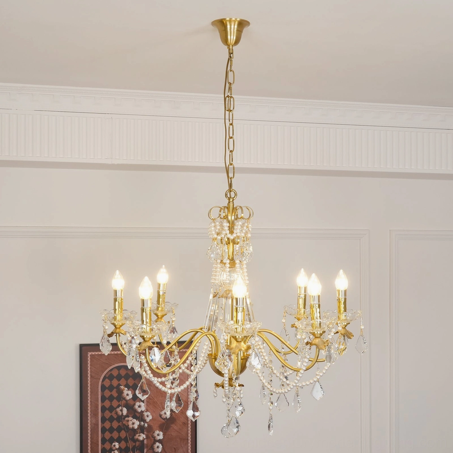 Vintage-inspired brass crystal chandelier with warm polished finish and delicate hanging crystals