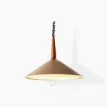 Vintage cone-shaped pendant light in caramel matte finish, front studio view showcasing mid-century modern design