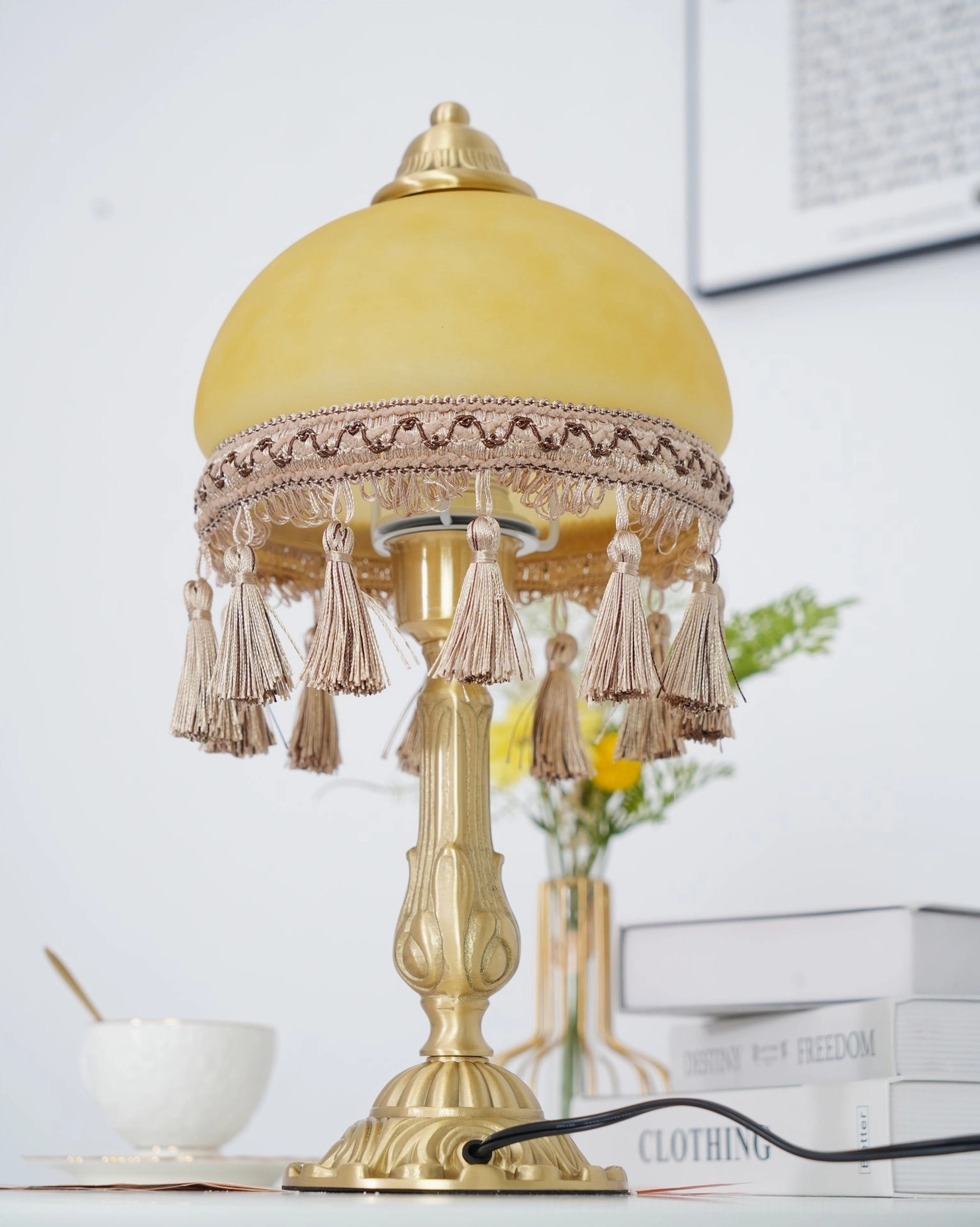 Vintage European brass table lamp with elegant tassel ornamentation detail