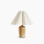 Vintage fluted beige table lamp with wooden base, studio shot on pure white background showcasing pleated linen shade design