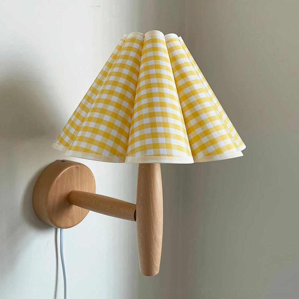 Vintage fluted plug-in wall lamp with beige and black plaid pleated shade detail closeup