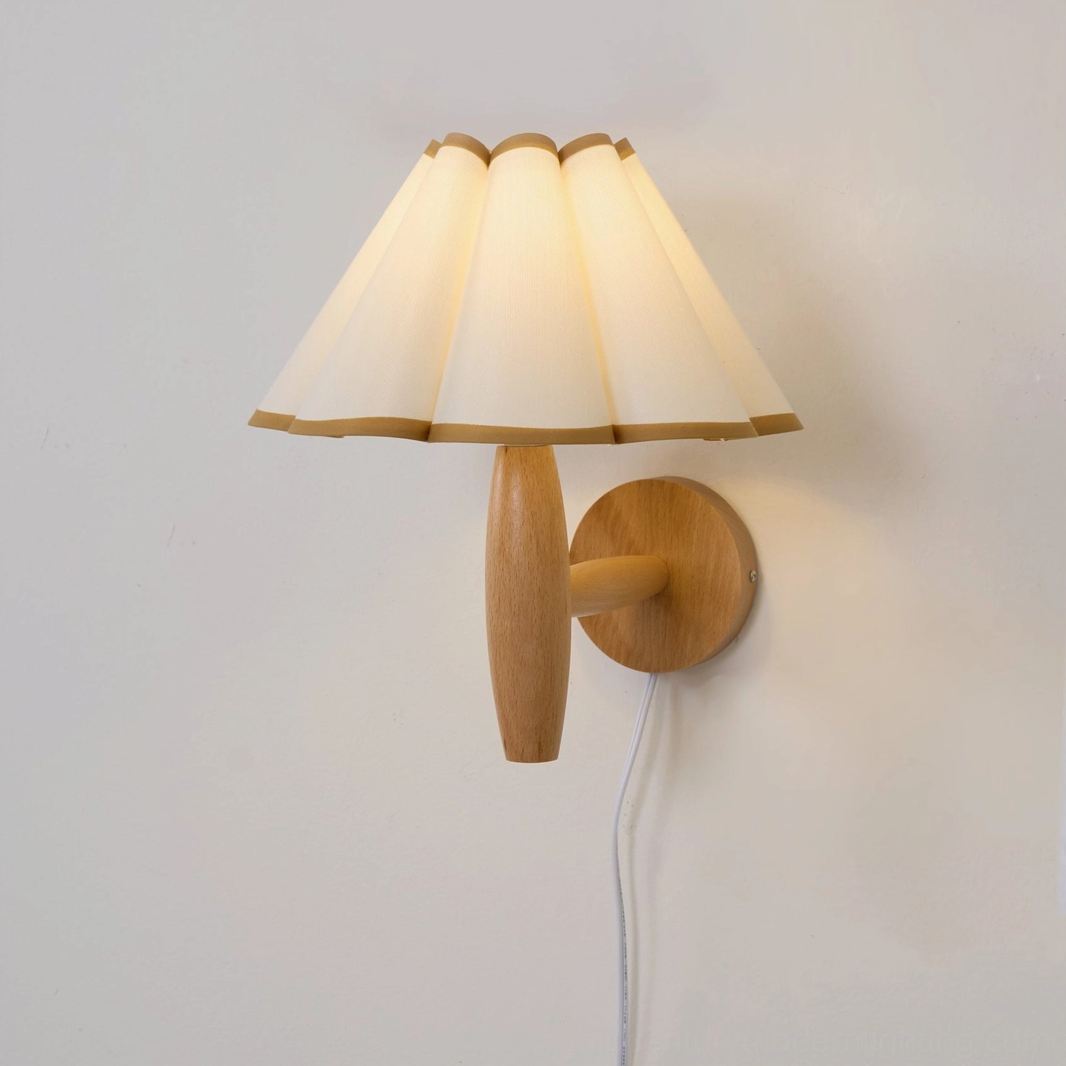 Vintage fluted wall lamp styled in contemporary interior with sheer curtain and window light