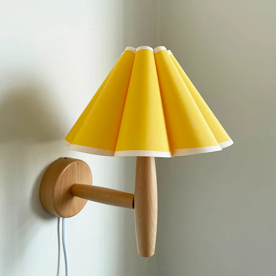 Vintage plug-in wall lamp with yellow pleated shade mounted on interior wall corner