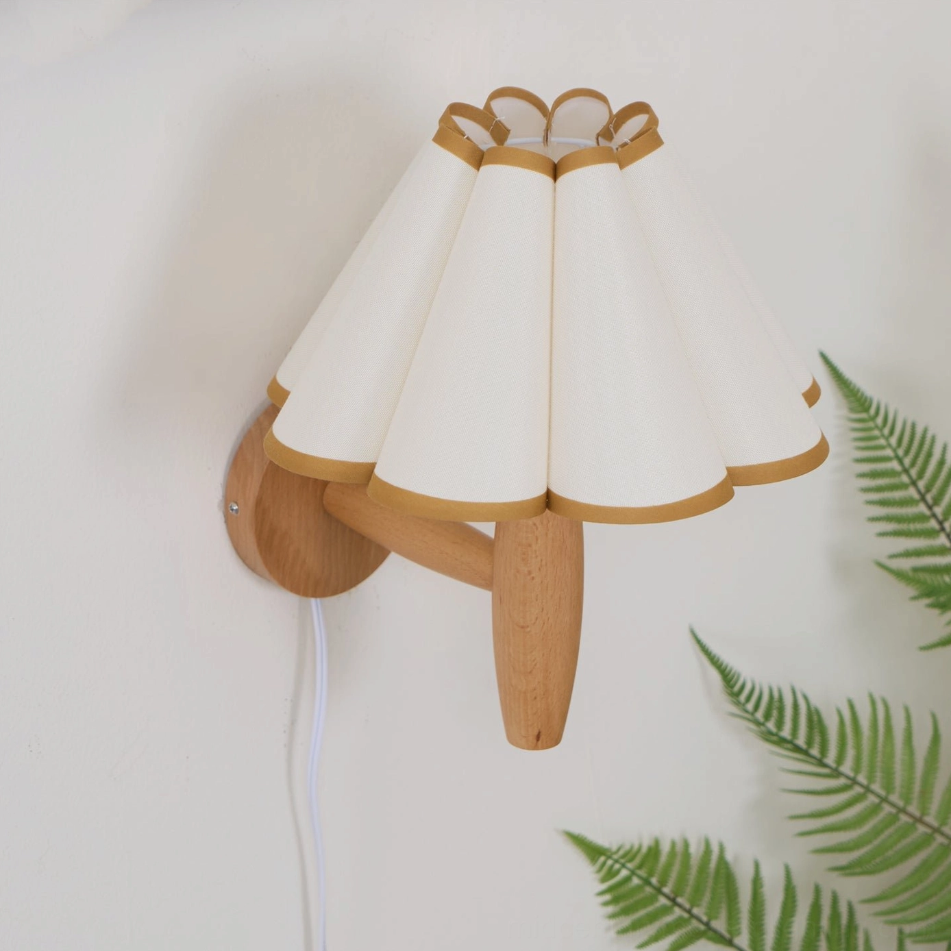 Vintage fluted plug-in wall lamp with dark khaki and black pleated fabric shade closeup