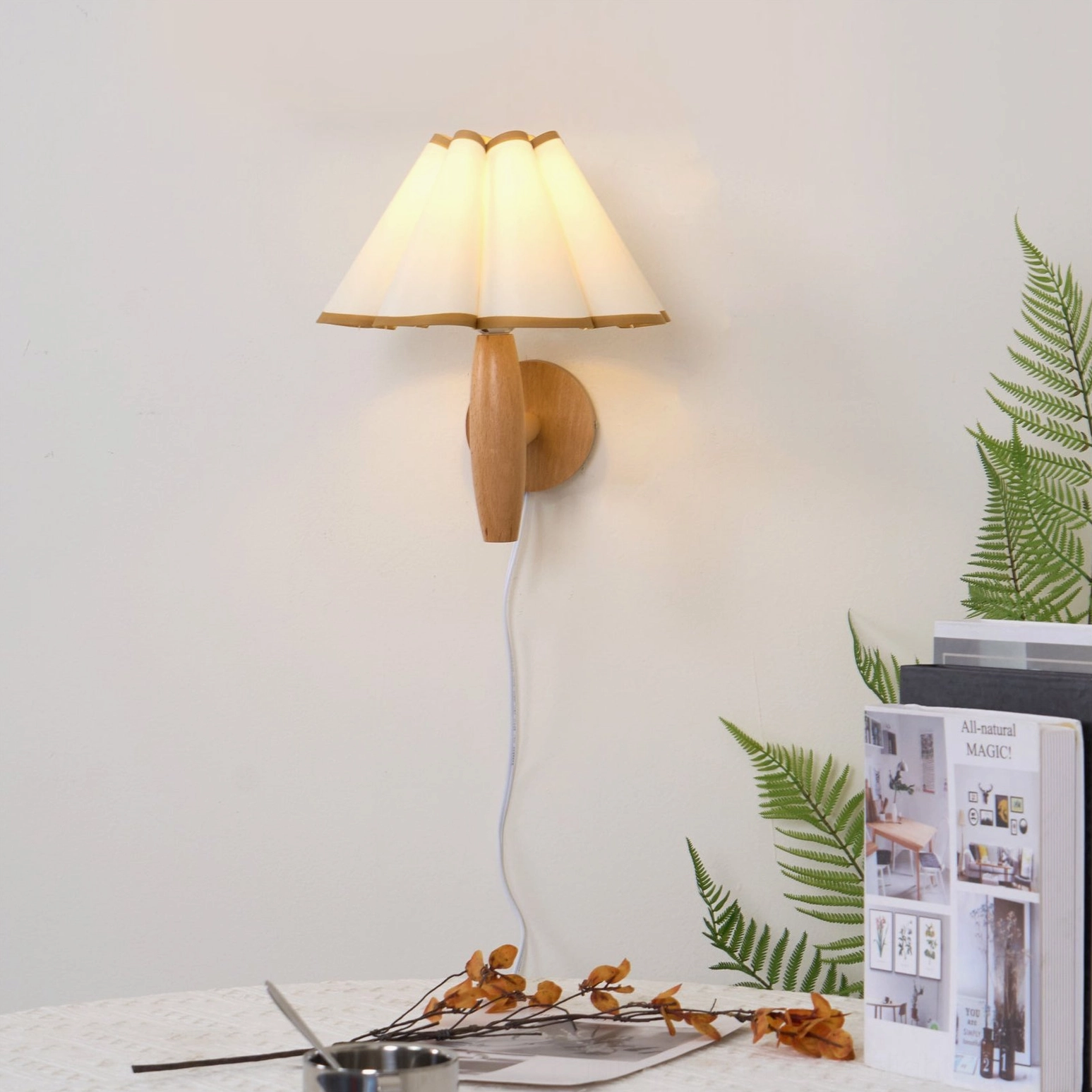 Mid-century modern fluted wall lamp with pink pleated fabric shade and natural wood details