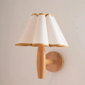 Mid-century modern plug-in wall lamp with white and yellow pleated fabric shade, close-up detail