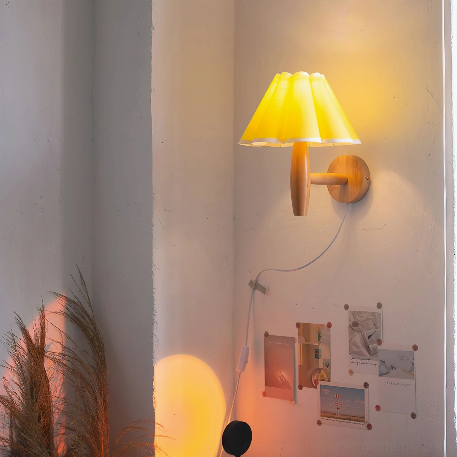 Mid-century modern fluted wall lamp with yellow pleated shade detail and natural wood base