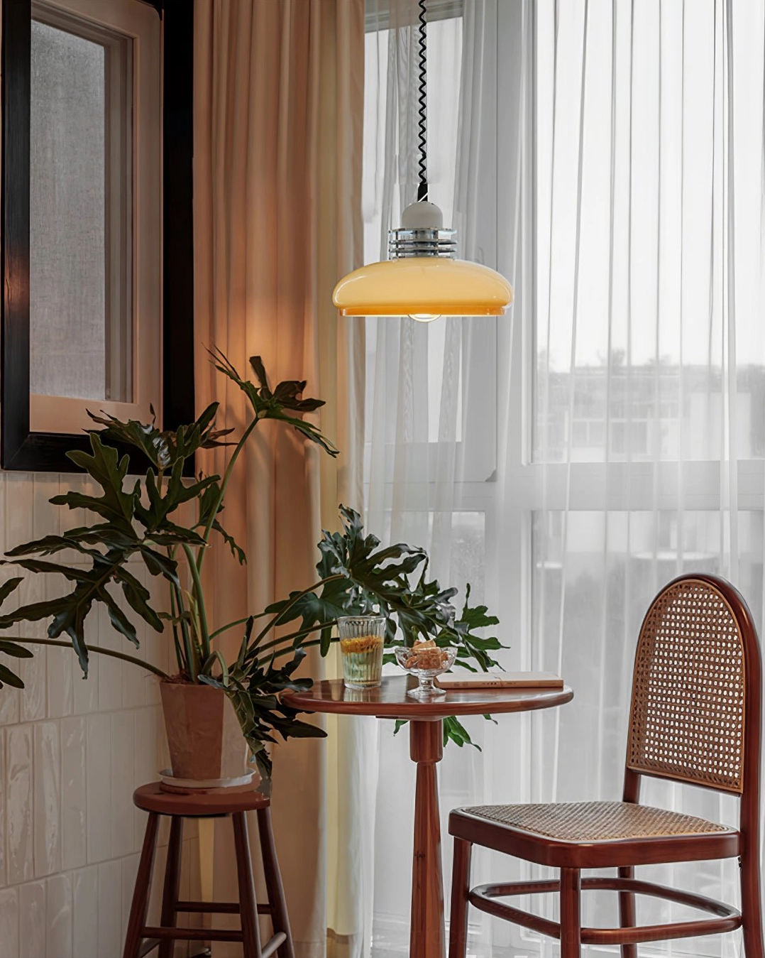 Beige orange gradient glass pendant lamp detail showing glass quality, color gradation, and light transmission properties