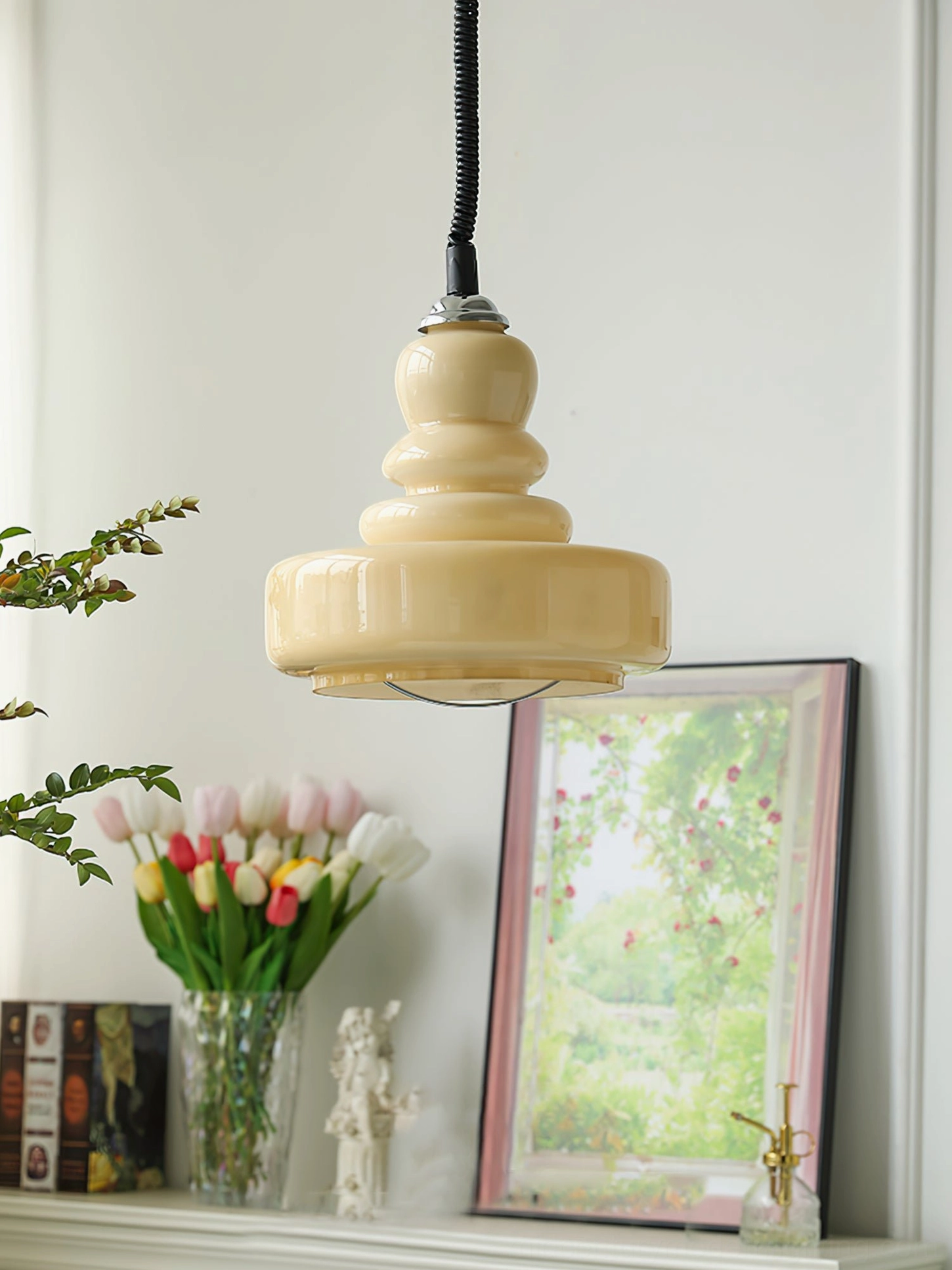 Beige tiered gourd glass pendant displayed on living room mantel with vintage home decor styling and retro aesthetic