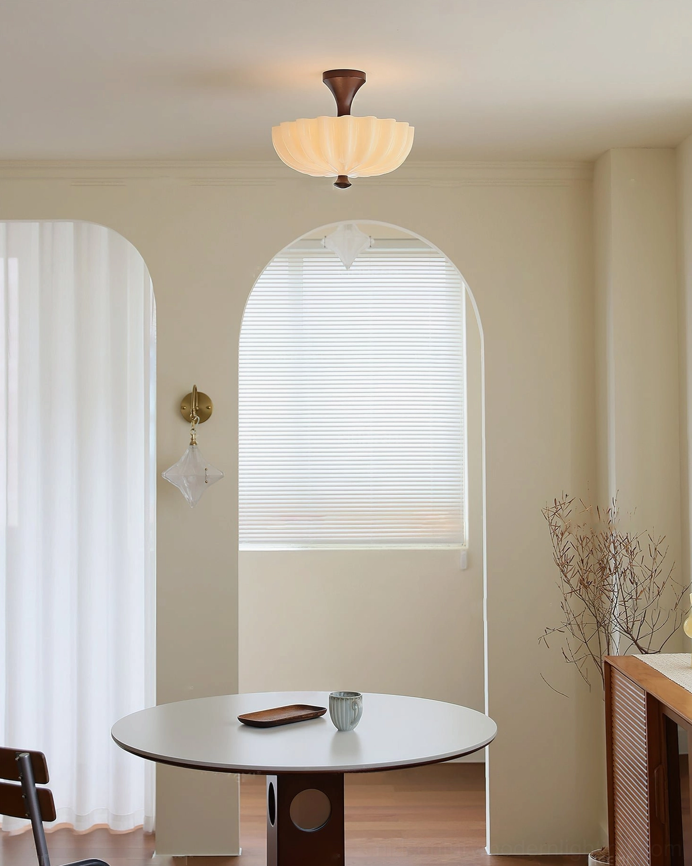 Bofea scalloped ceiling lamp illuminated in master bedroom with wooden headboard and warm retro lighting