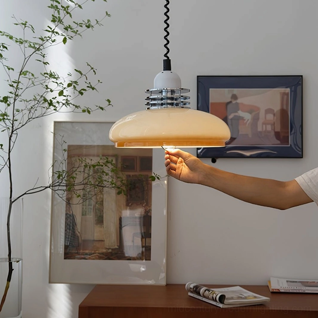 Vintage pendant lamp in situ, side view demonstrating warm ambient lighting in decorated living space with wall art