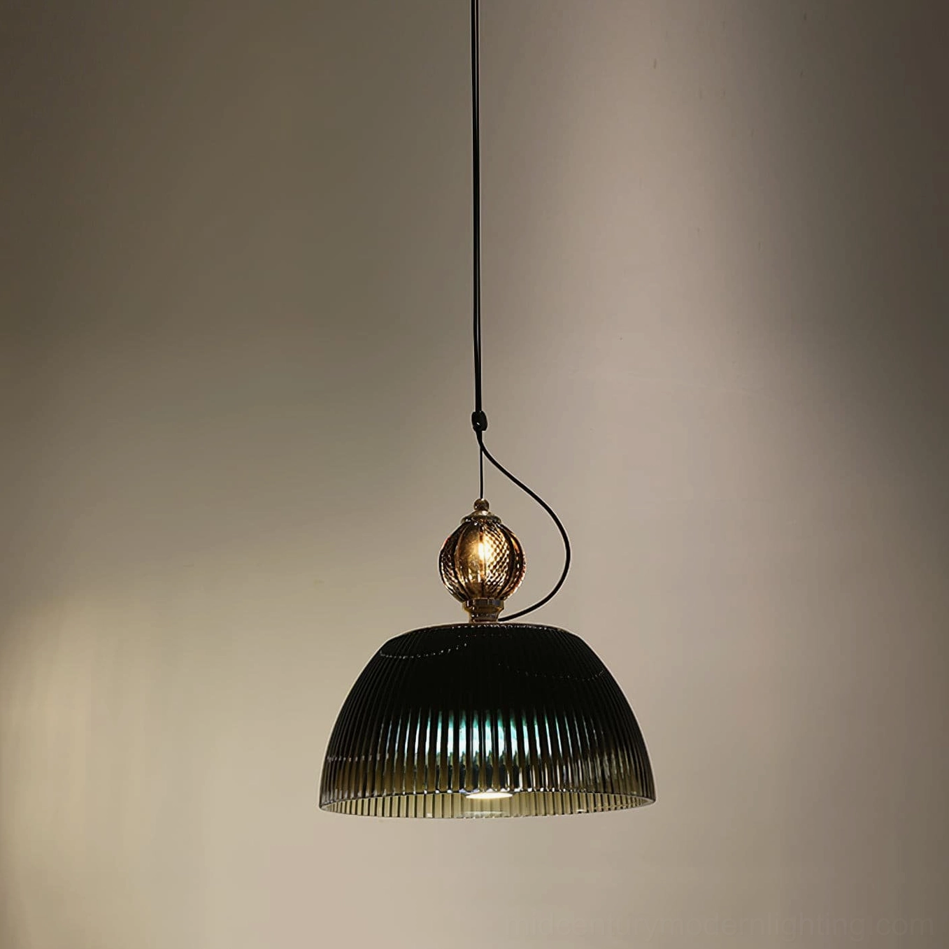 Side profile of vintage ribbed glass pendant showing curved dome shape and suspension hardware