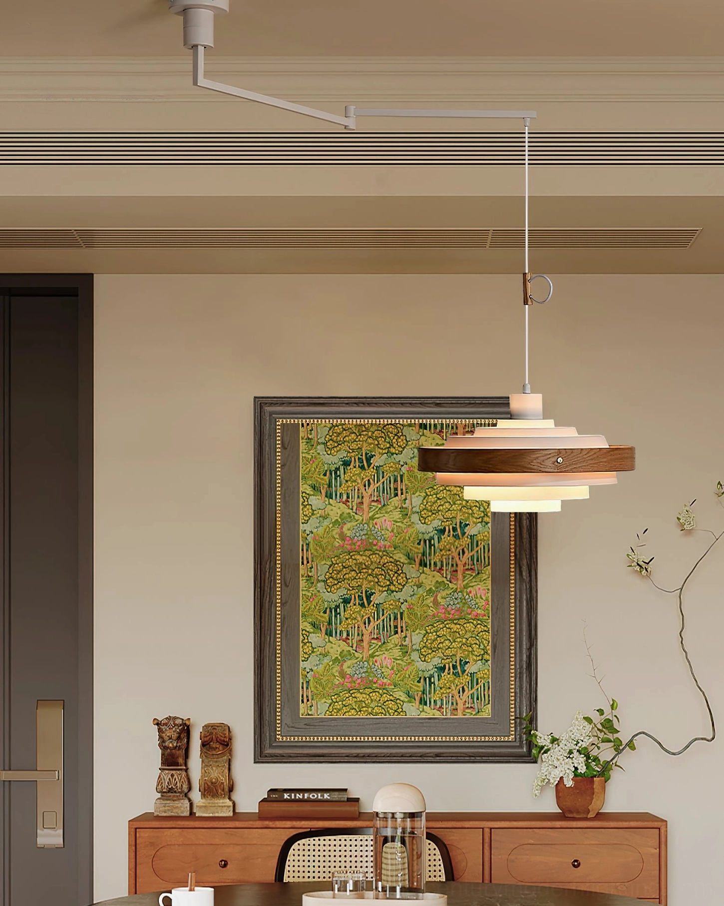 Layered pendant light with wood and white metal tiers in vintage dining room with wall art