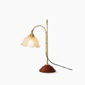 Textured glass table lamp with brass pole and wood base, front view on white background, mid-century modern design