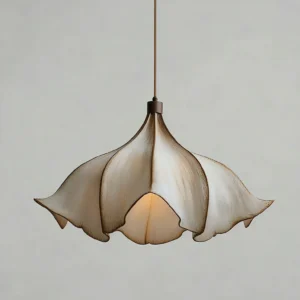 Close-up detail of Viscontea pendant light showing textured PETG polymer web and warm interior glow, low overhead angle