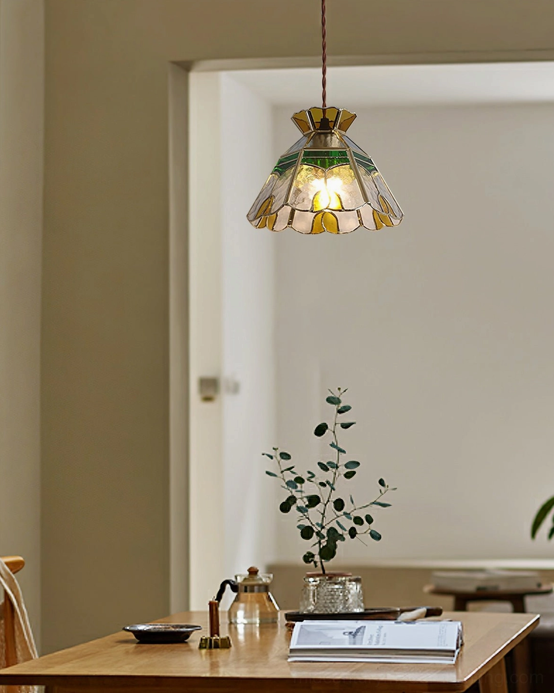 Handcrafted stained glass pendant lamp showing brass frame and color glass shade construction