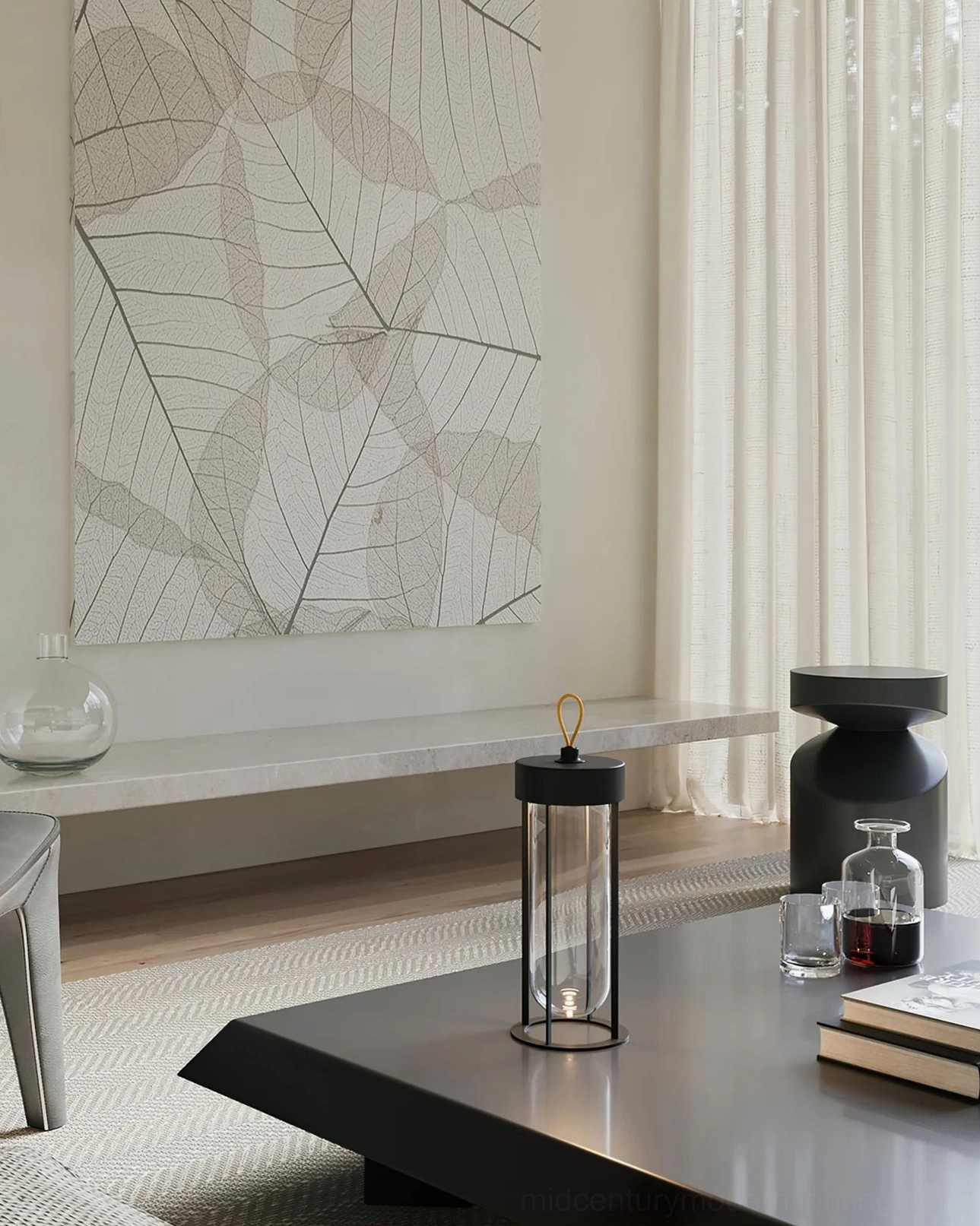 Vitro LED portable lamp on modern coffee table with glassware and design books
