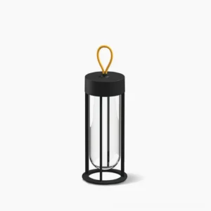 Vitro cordless LED table lamp with matte black metal frame and glass diffuser in minimalist studio setting