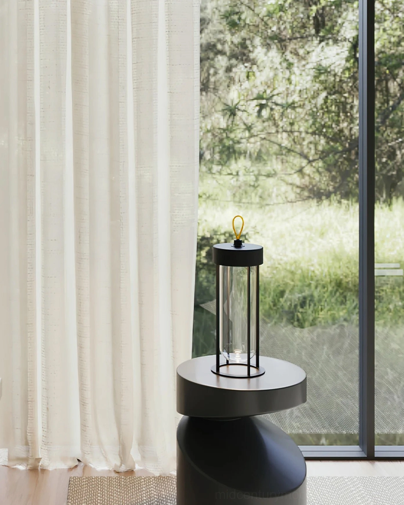 Vitro cordless LED lantern on black side table in sunlit contemporary living room