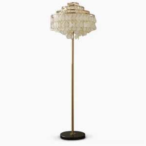 Vivant tiered capiz shell floor lamp with gold metal frame and white shells, front view in studio