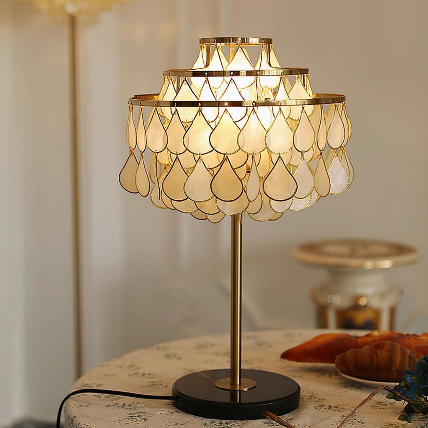 Vivant Shell Table Lamp on round dining table with croissants realistic home décor scene